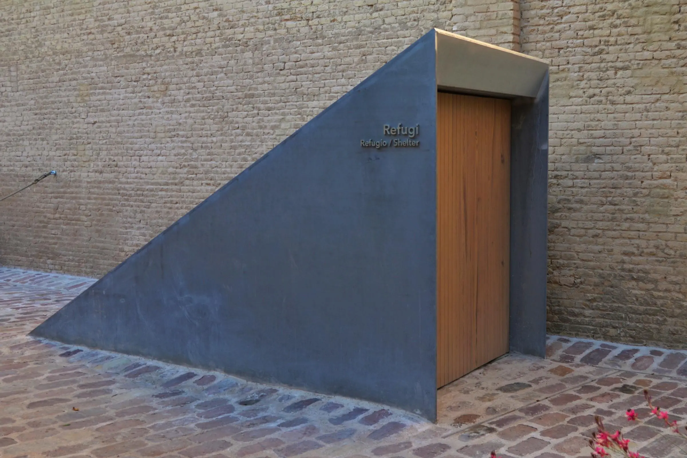 The modern concrete entrance leading down into the preserved Spanish Civil War air-raid shelter at Bombas Gens
