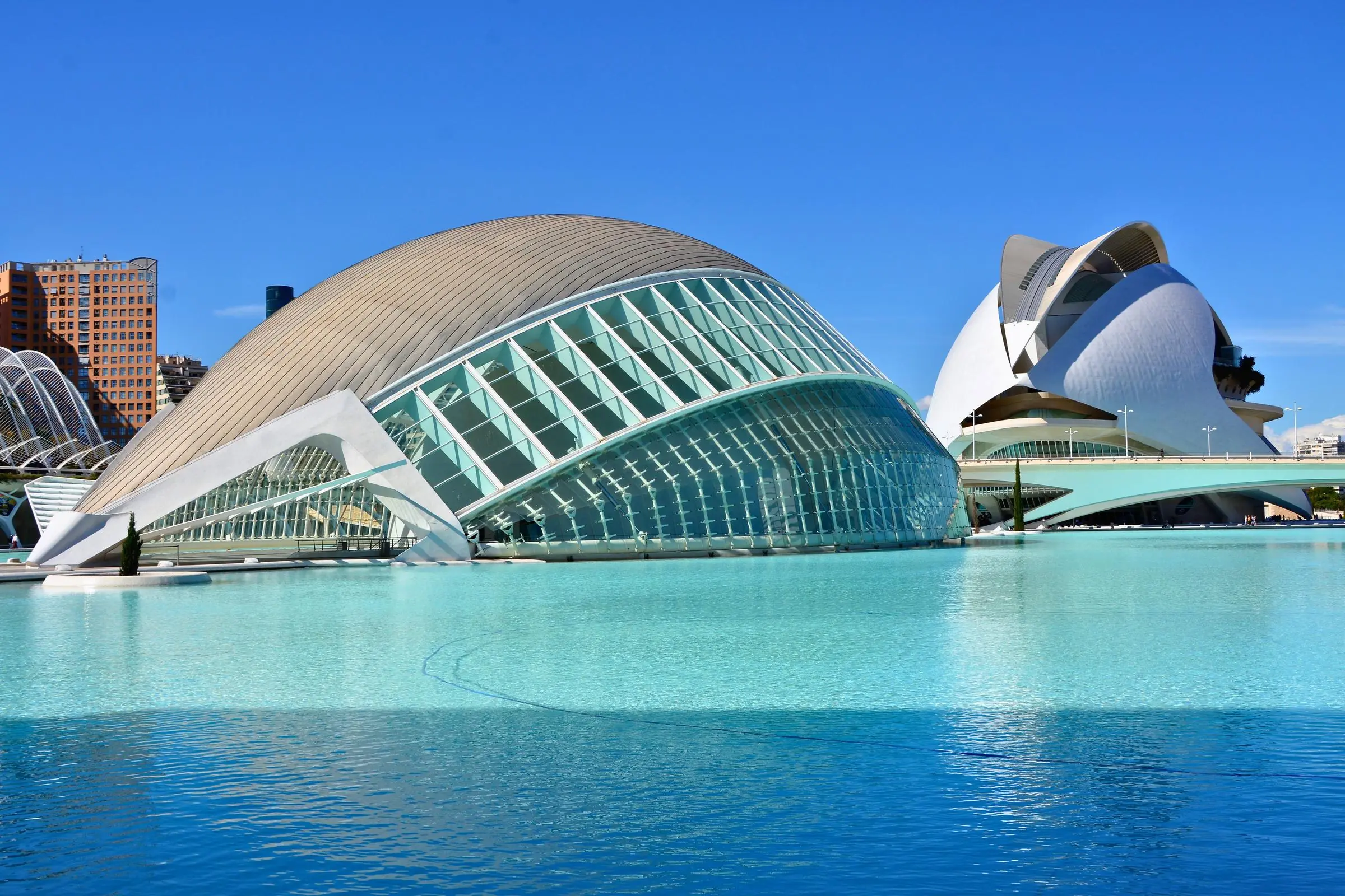 Hemisfèric Valencia The exterior of the Hemisfèric building reflecting in the surrounding blue pools