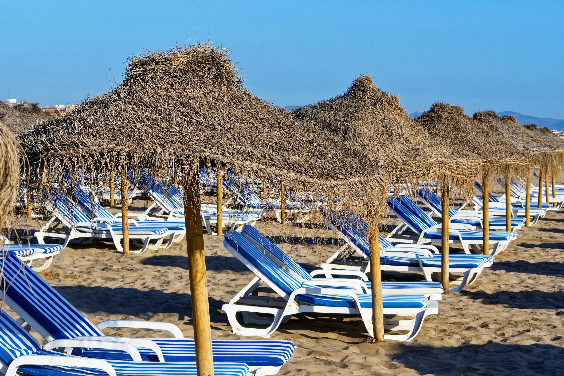 Sun loungers and umbrellas on Malvarrosa Beach
