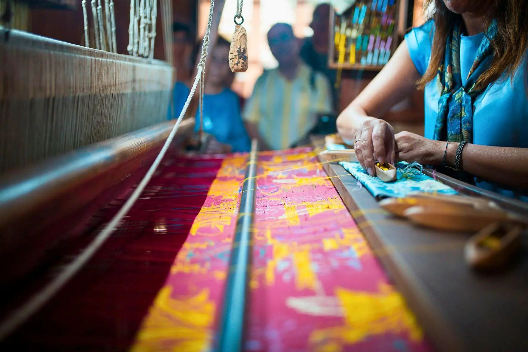 Working wooden looms at the Silk Museum
